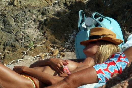 Heidi Klum sunbathing topless