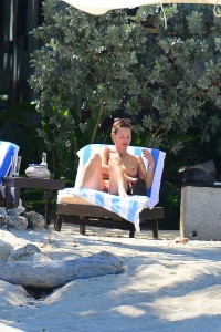 Kate Moss sunbathing topless