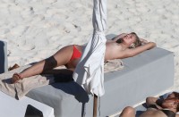 Toni Garrn sunbathing topless